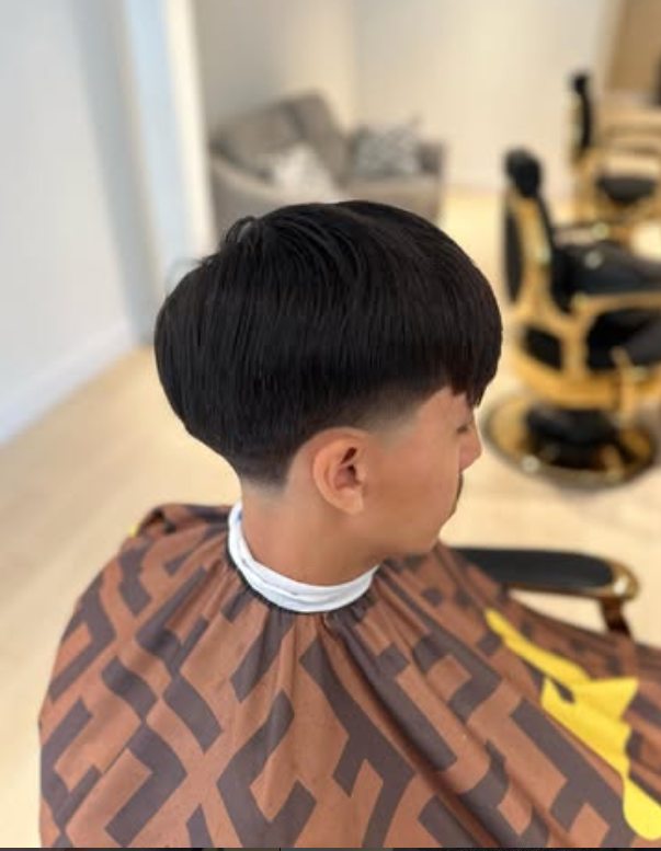 Barber giving a fade haircut in Coquitlam