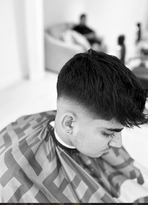 Barber giving a fade haircut in Coquitlam
