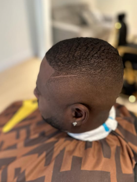 Barber giving a fade haircut in Coquitlam