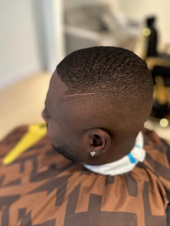 Barber giving a fade haircut in Coquitlam